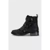 Black suede boots decorated with rhinestones