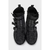 Black suede boots decorated with rhinestones