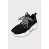 Black lace-up sneakers