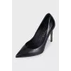 Black leather pumps