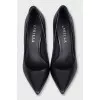 Black leather pumps