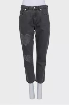 Tapered grey jeans with distressing