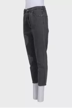 Tapered grey jeans with distressing