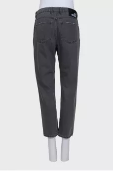 Tapered grey jeans with distressing