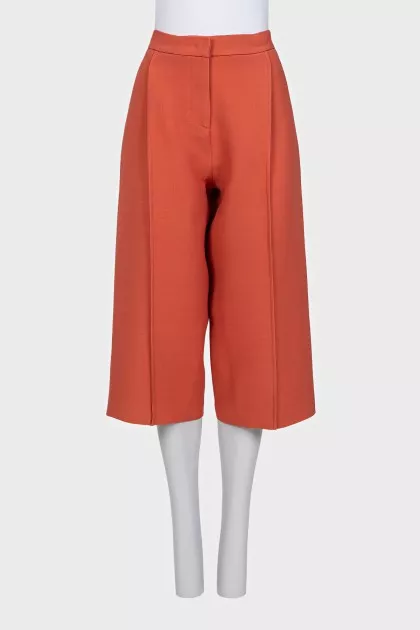 Orange cropped trousers