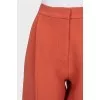 Orange cropped trousers