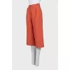 Orange cropped trousers