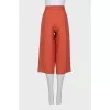 Orange cropped trousers