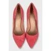 Pink snakeskin pumps