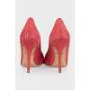 Pink snakeskin pumps