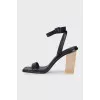 Black leather sandals with clear heels