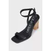 Black leather sandals with clear heels