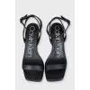 Black leather sandals with clear heels