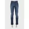 Men's blue jeans with silver logo