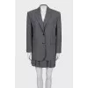 Pinstripe suit consisting of a jacket and skirt