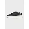 Black leather sneakers with silver logo