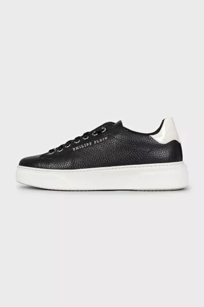 Black leather sneakers with silver logo