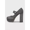 Suede platform shoes with embellished heels