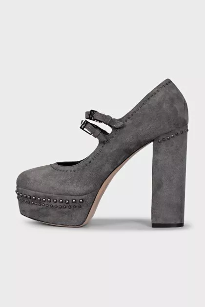 Suede platform shoes with embellished heels