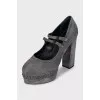 Suede platform shoes with embellished heels