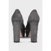 Suede platform shoes with embellished heels