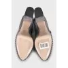Suede platform shoes with embellished heels