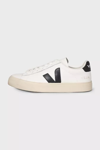 Black and white leather sneakers with a signature logo
