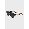 Sunglasses with gold inserts