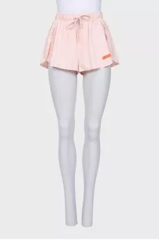A suit consisting of a tank top and shorts with a tag