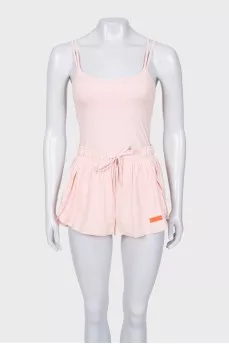 A suit consisting of a tank top and shorts with a tag