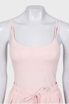 A suit consisting of a tank top and shorts with a tag