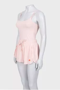 A suit consisting of a tank top and shorts with a tag