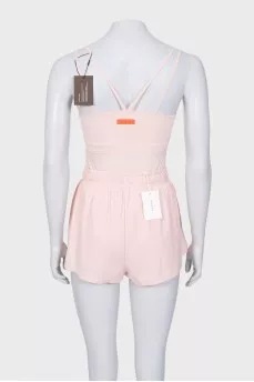 A suit consisting of a tank top and shorts with a tag