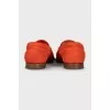 Orange leather loafers