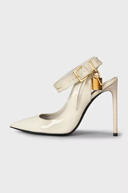 Patent leather slingbacks with a gold pendant