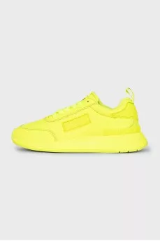 Yellow leather sneakers with the brand logo