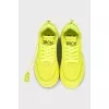 Yellow leather sneakers with the brand logo
