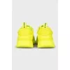Yellow leather sneakers with the brand logo