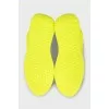Yellow leather sneakers with the brand logo