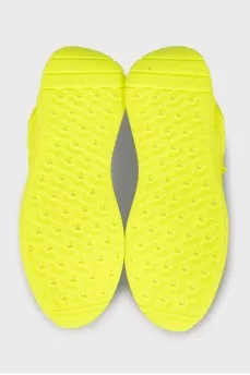 Yellow leather sneakers with the brand logo