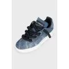 Blue sneakers with chunky laces