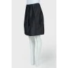 Large pleated graphite skirt