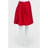 Asymmetric pleated skirt