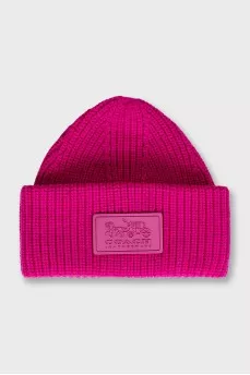 Pink knitted hat with logo