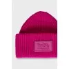 Pink knitted hat with logo