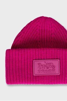 Pink knitted hat with logo
