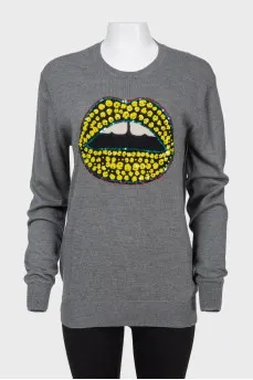 Sweater with sequins in the form of lips