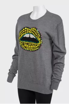 Sweater with sequins in the form of lips