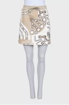 Printed suit consisting of a zip-up hoodie and a skirt