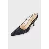 Black slingbacks decorated with rhinestones